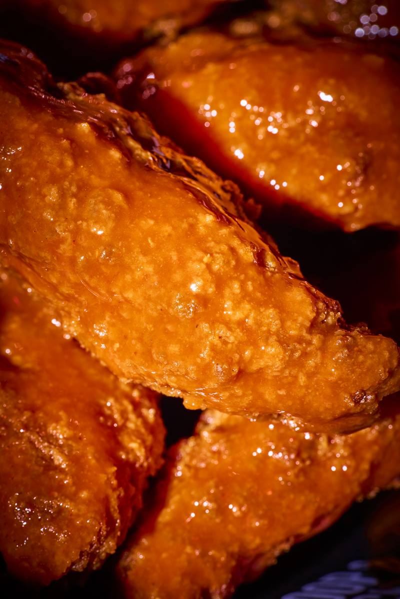 Close-up of a sauce-coated tender