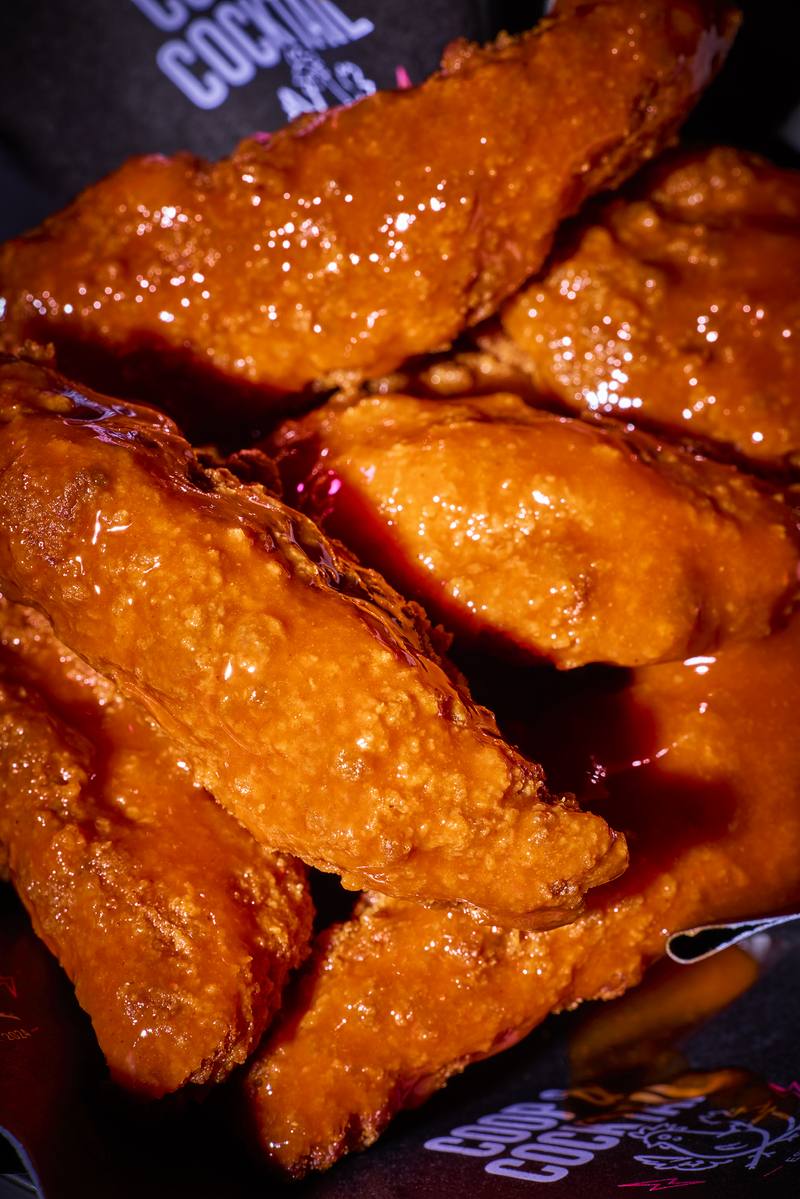 Close-up of glossy sauce-coated tenders