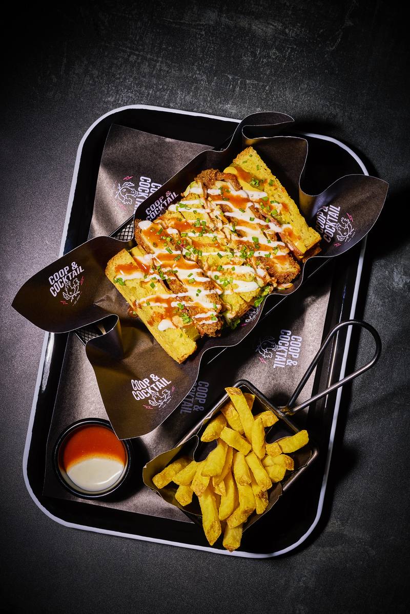 Buffalo ranch toast on a tray with fries and a dip